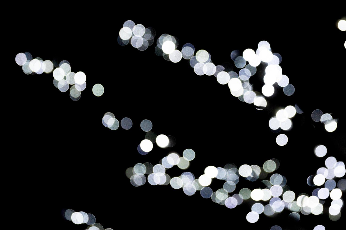 Abstract blur black and white bokeh background. many round light on background photo
