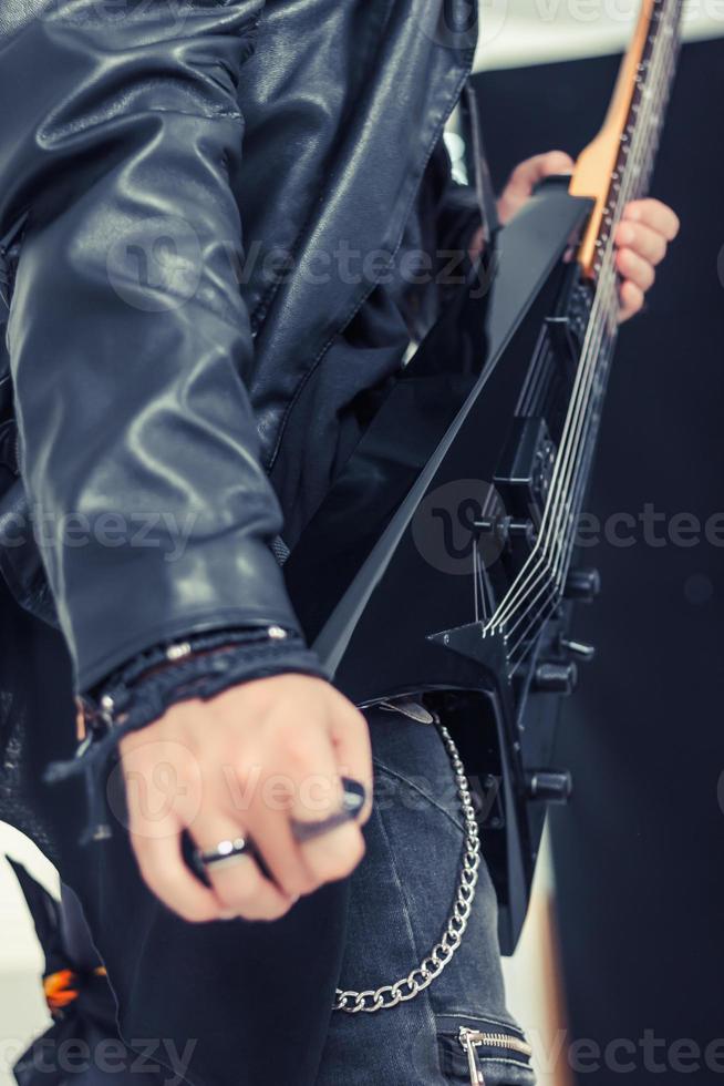 Unrecognizable musician playing electric guitar. photo