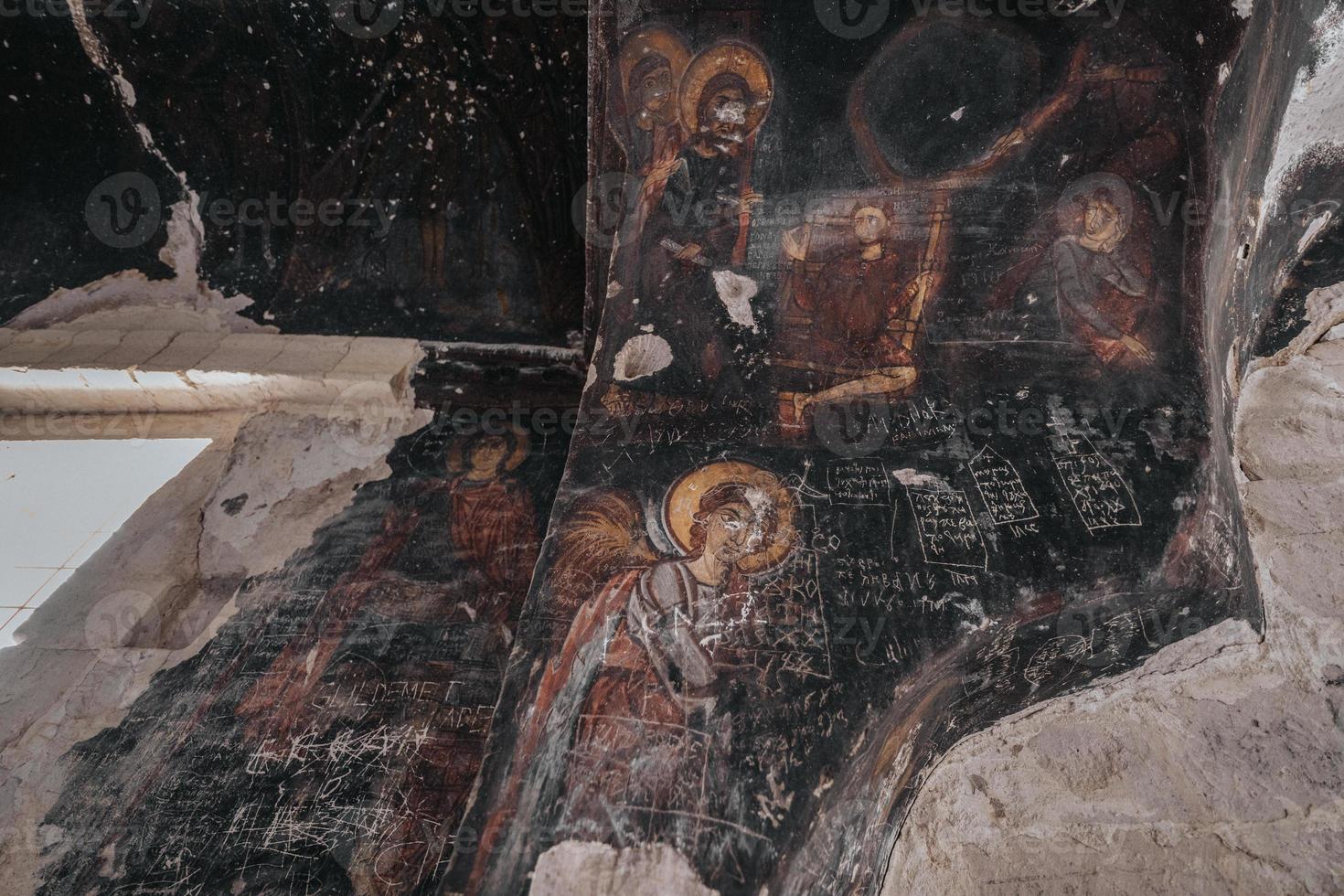 A cave church in Cappadocia with inscriptions on the walls, frescoes from the beginning of Christianity. photo