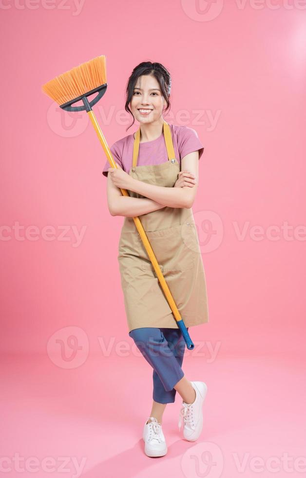 Young Asian woman housewife on background photo