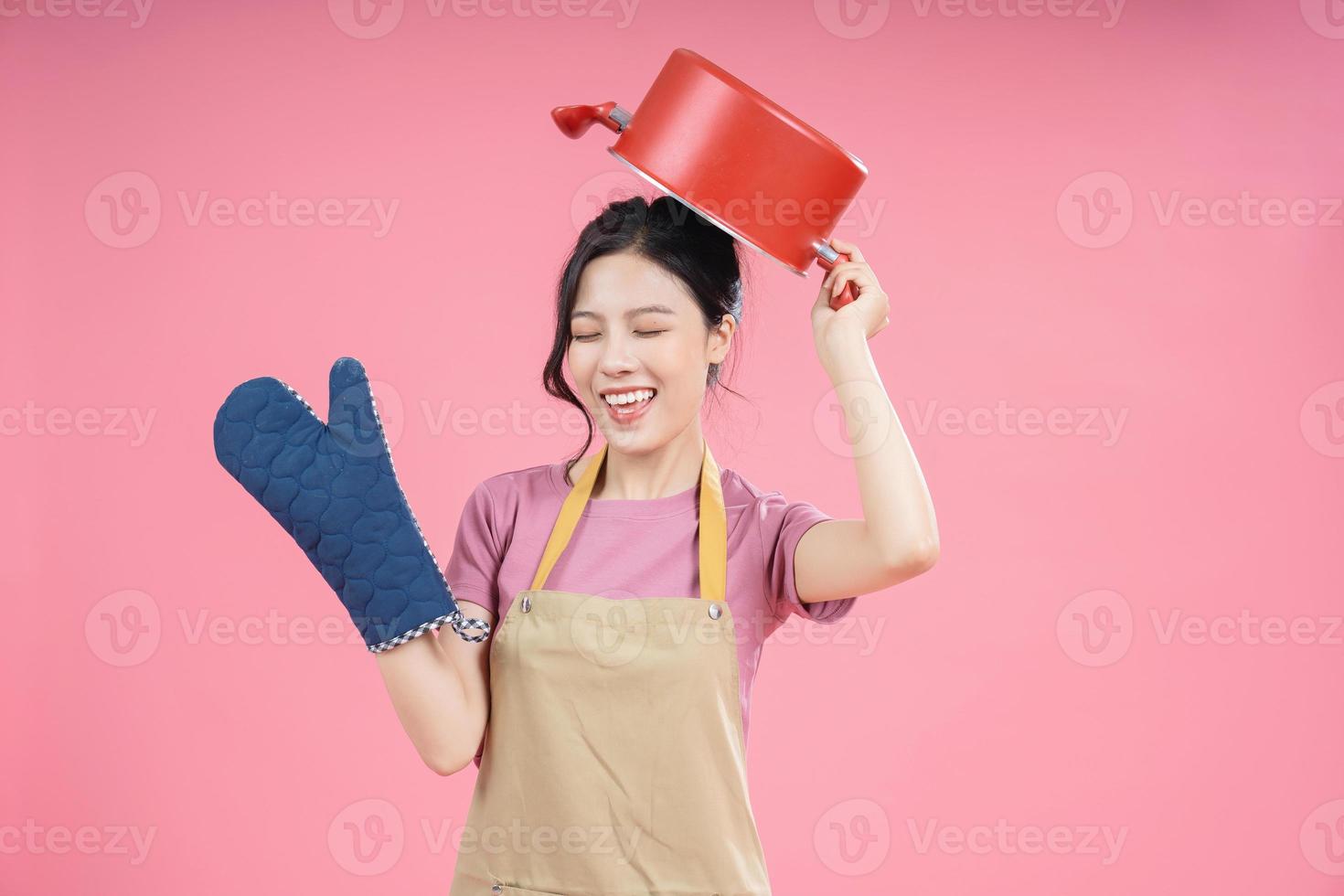 Young Asian woman housewife on background photo