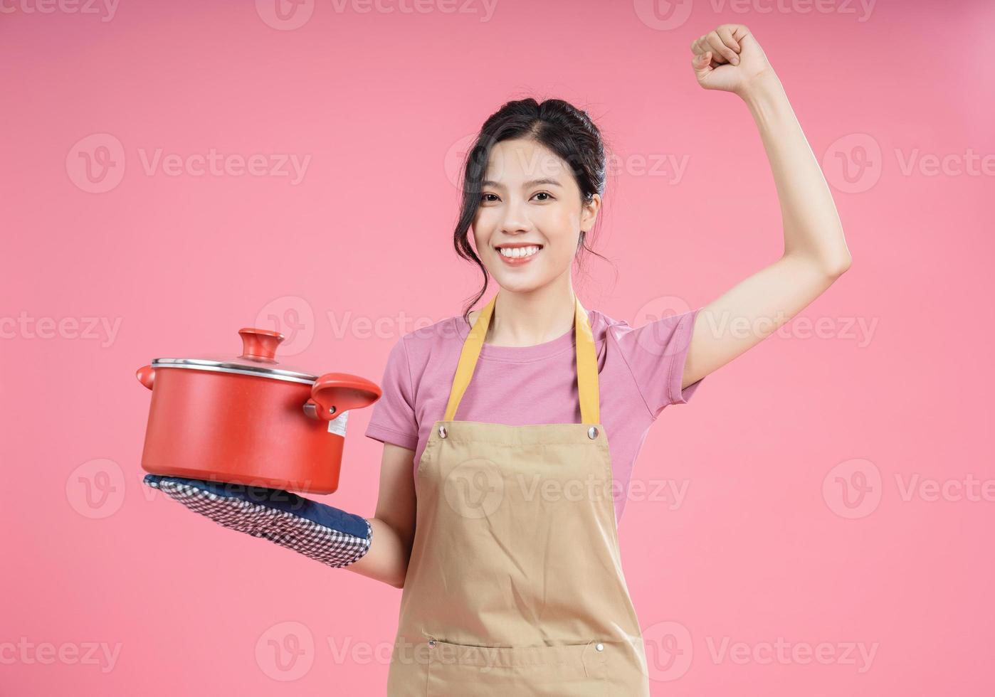 Young Asian woman housewife on background photo