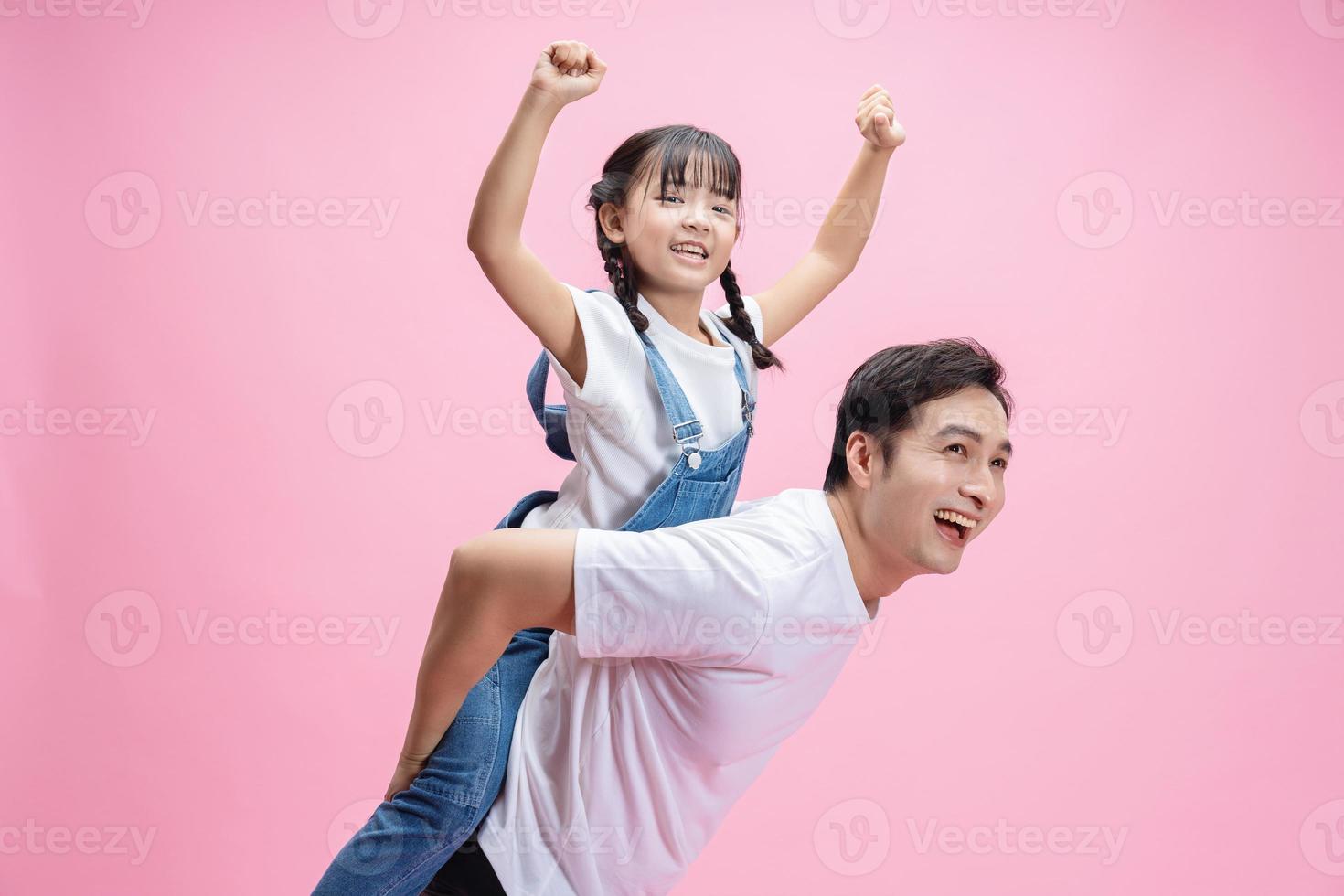 Image of Asian father and daughter on background photo