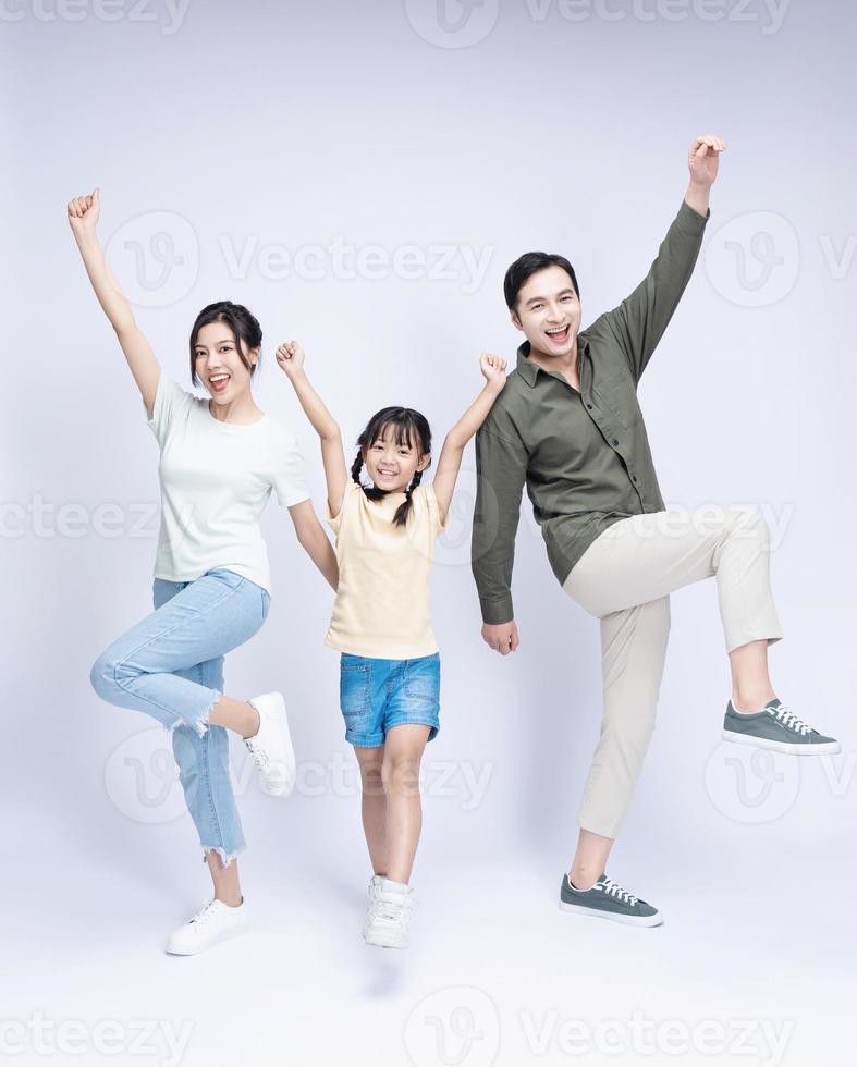 Image of Asian family on background photo