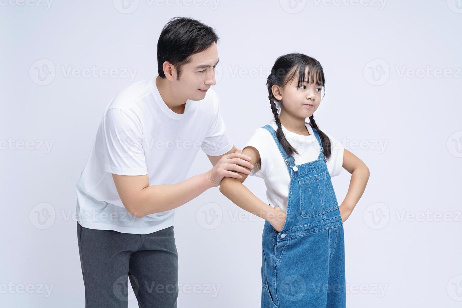 Image of Asian father and daughter on background photo