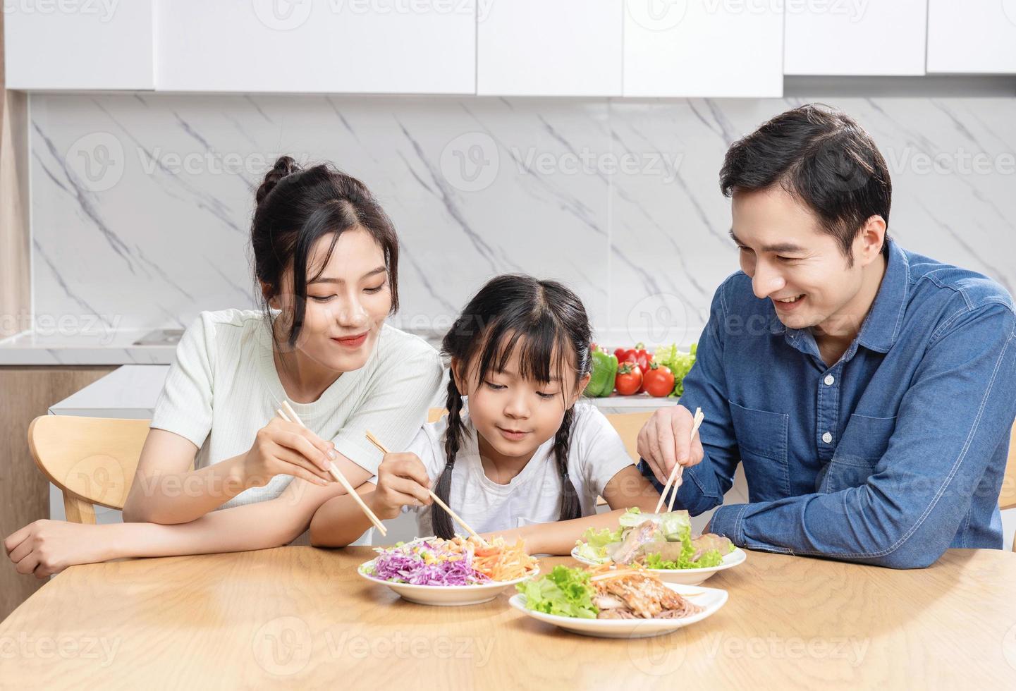 Image of Asian family in the kitchen photo