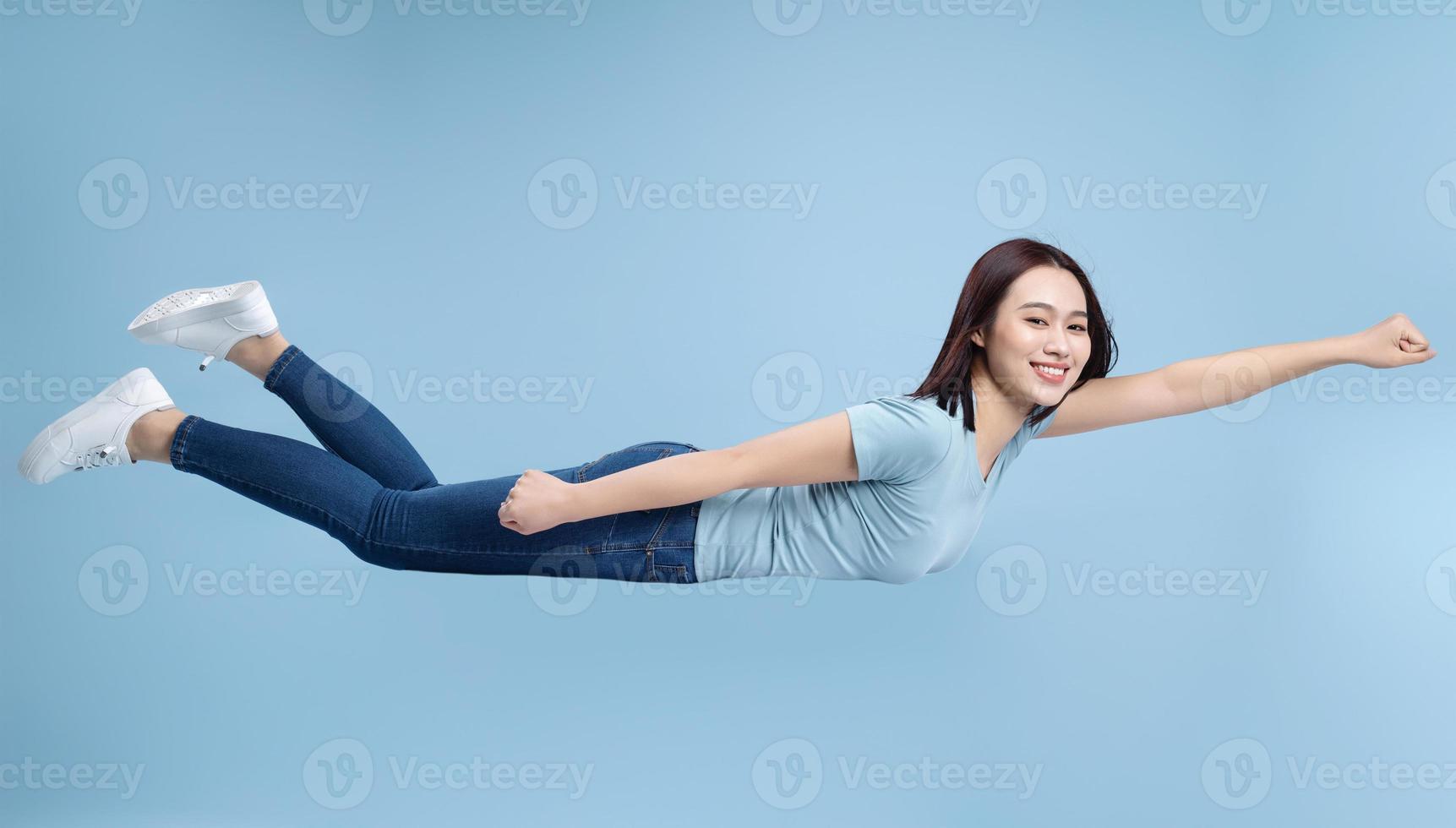 Image of young Asian woman posing on background photo