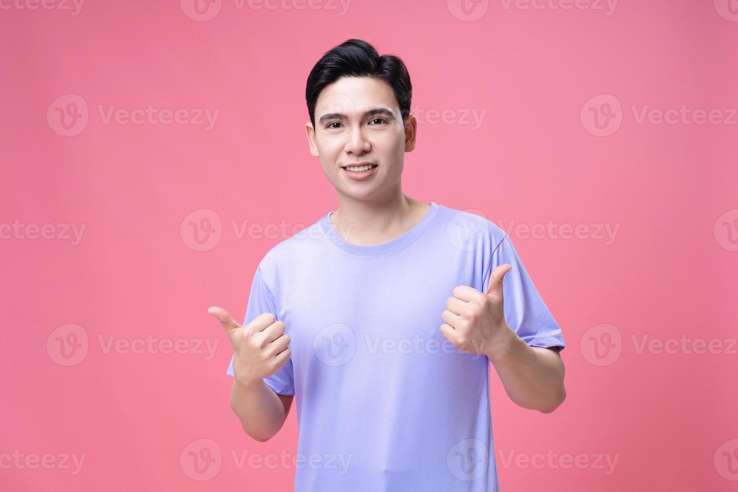 Portrait of young Asian man on background photo