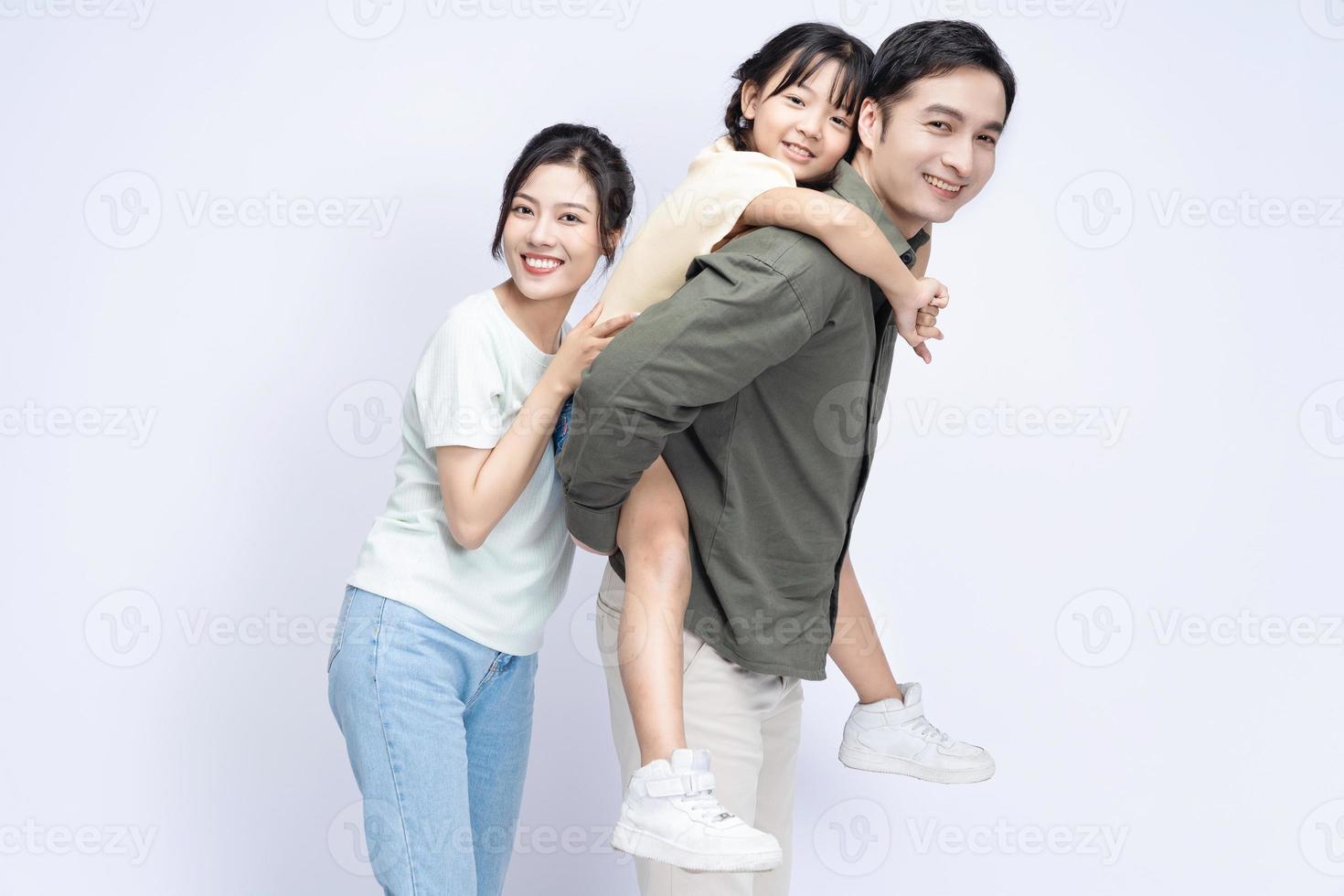 Image of Asian family on background photo