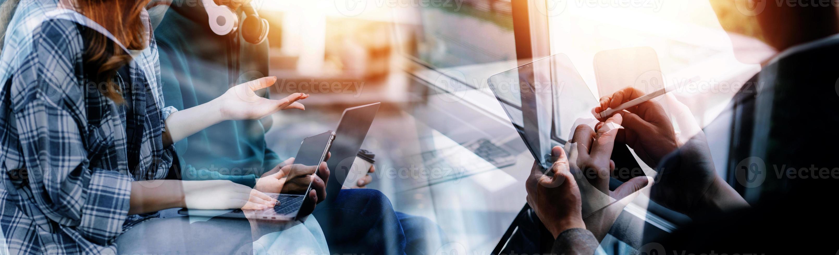 Financial analysts analyze business financial reports on a digital tablet planning investment project during a discussion at a meeting of corporate showing the results of their successful teamwork. photo