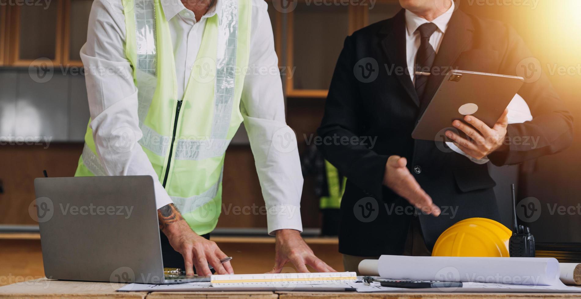Architect concept, Architects working with blueprints in the office, Vintage Effect photo