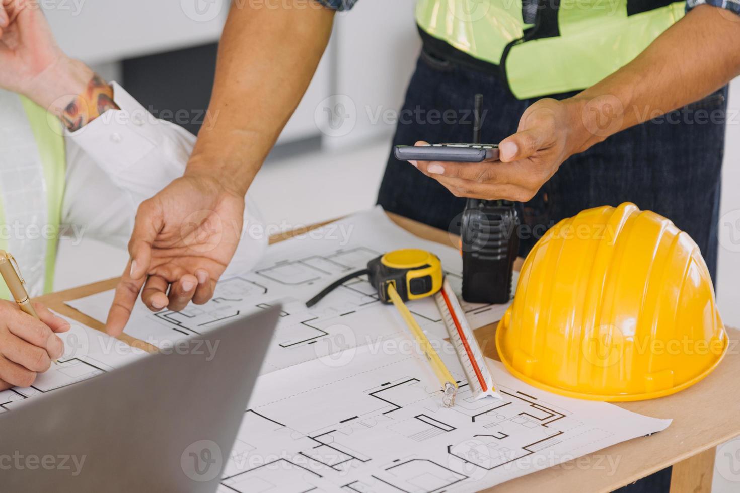 Architect concept, Architects working with blueprints in the office, Vintage Effect photo