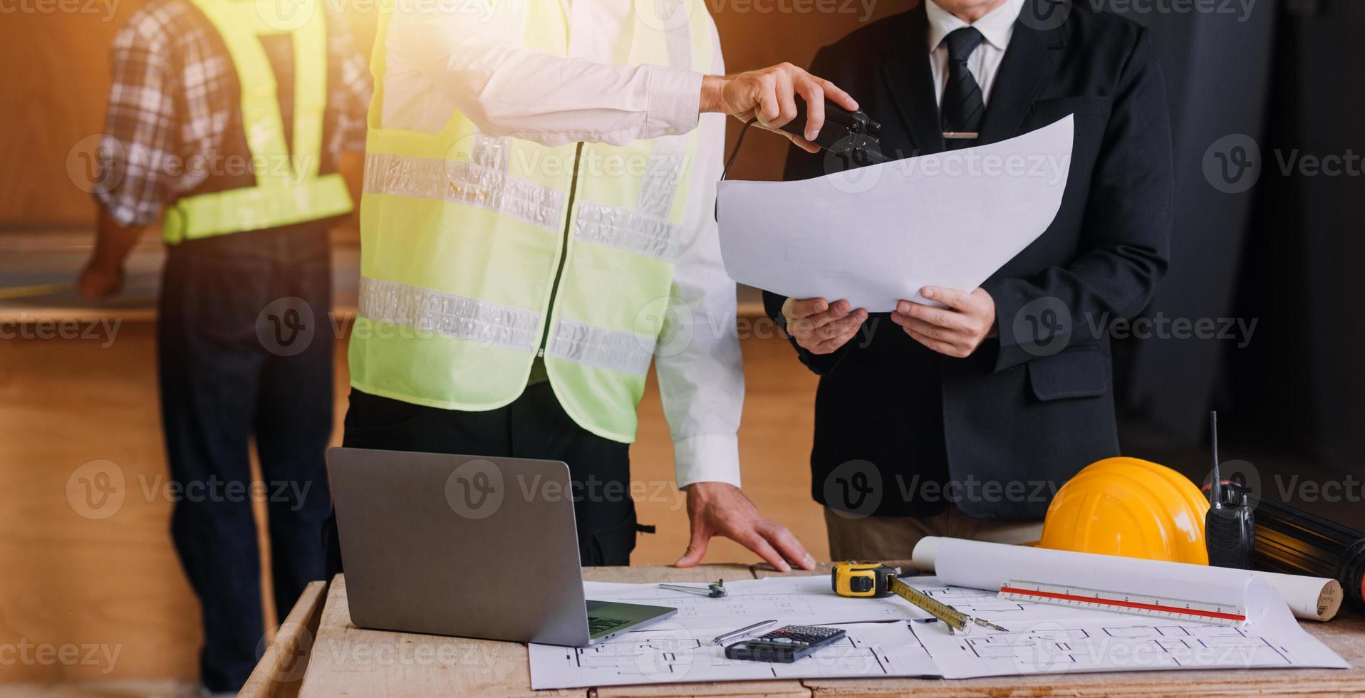 Architect concept, Architects working with blueprints in the office, Vintage Effect photo