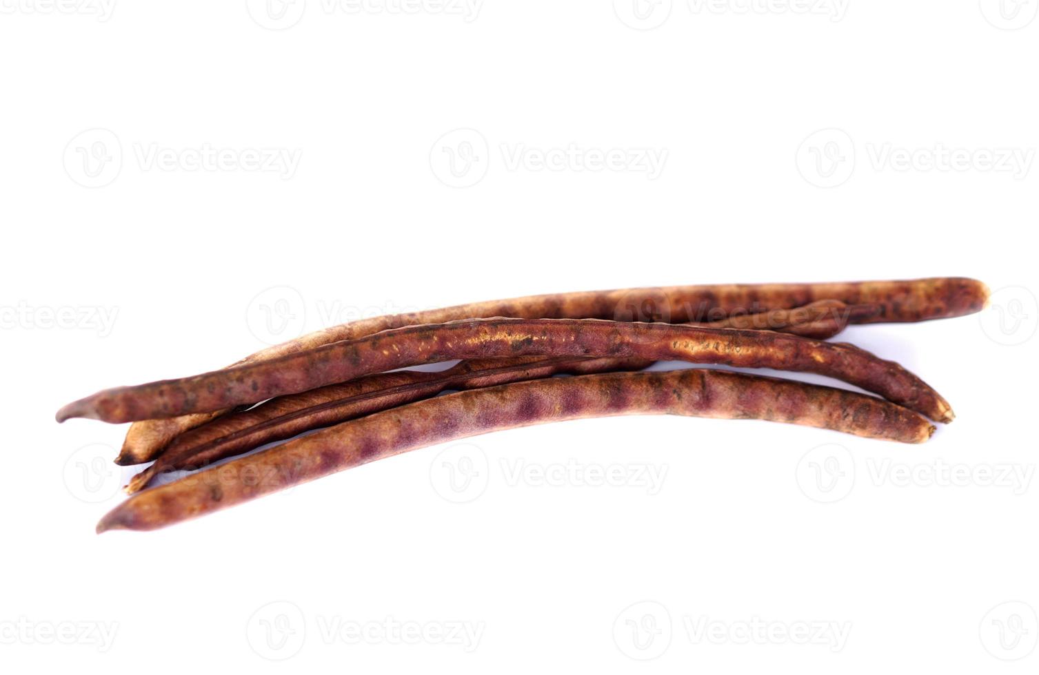 Dried red bean pods  on white background. Concept, Agriculture crop. Dried for preparing to select for next time seedling or for cooking. Thai native breed of beans. photo