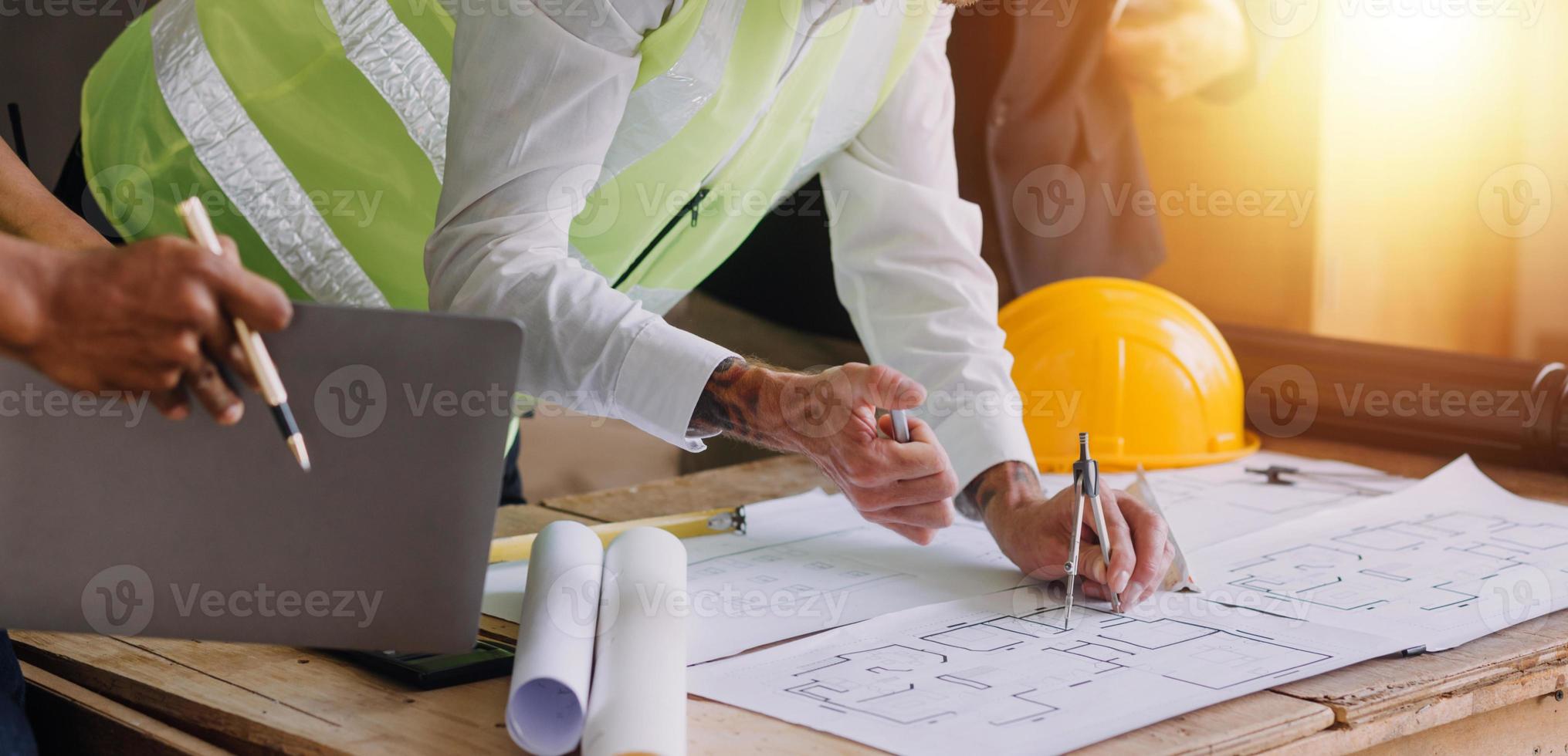 Architect concept, Architects working with blueprints in the office, Vintage Effect photo