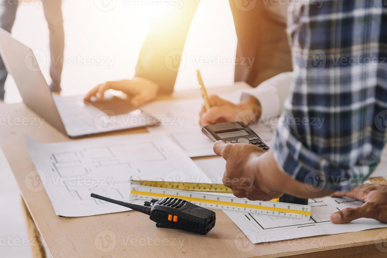 Architect concept, Architects working with blueprints in the office, Vintage Effect photo