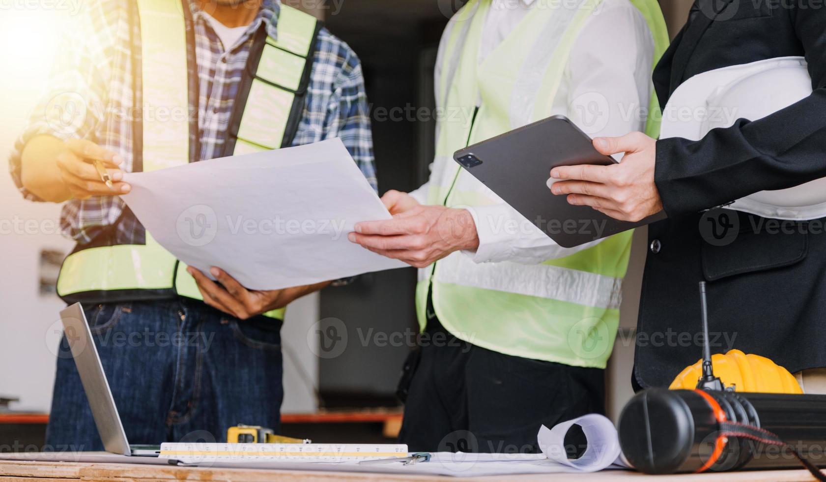 Architect concept, Architects working with blueprints in the office, Vintage Effect photo