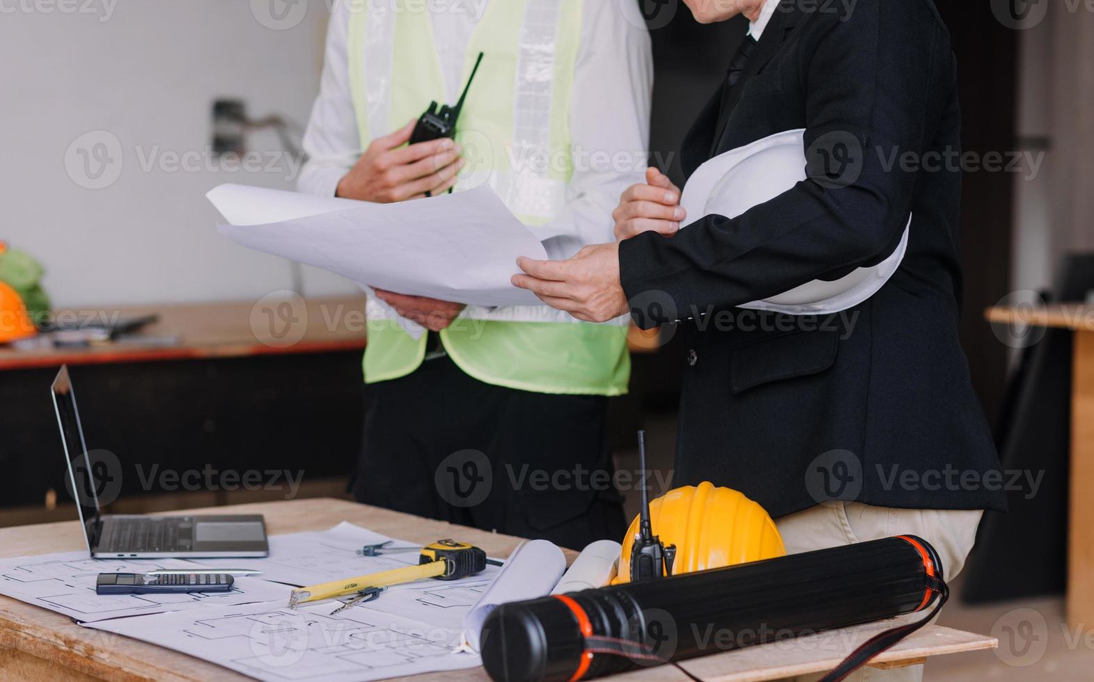 Architect concept, Architects working with blueprints in the office, Vintage Effect photo