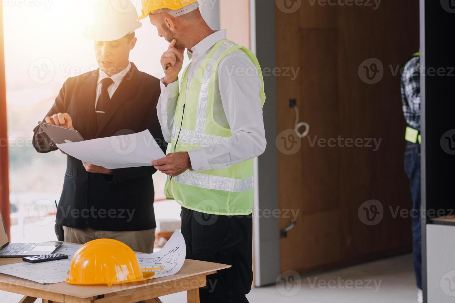 Architect concept, Architects working with blueprints in the office, Vintage Effect photo
