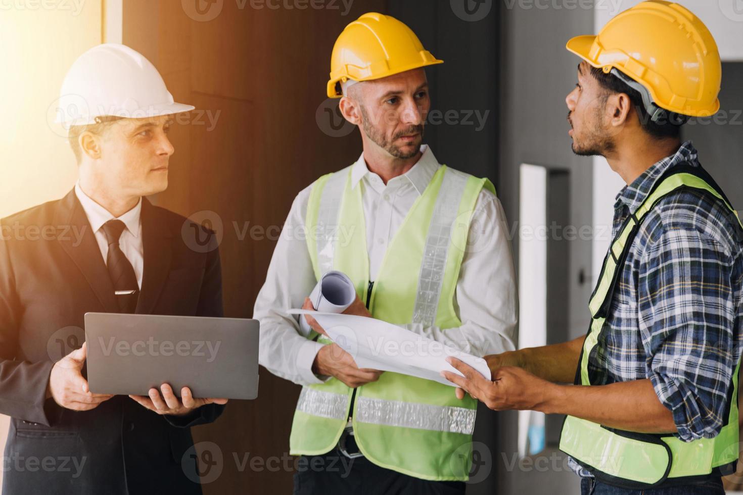 Architect concept, Architects working with blueprints in the office, Vintage Effect photo