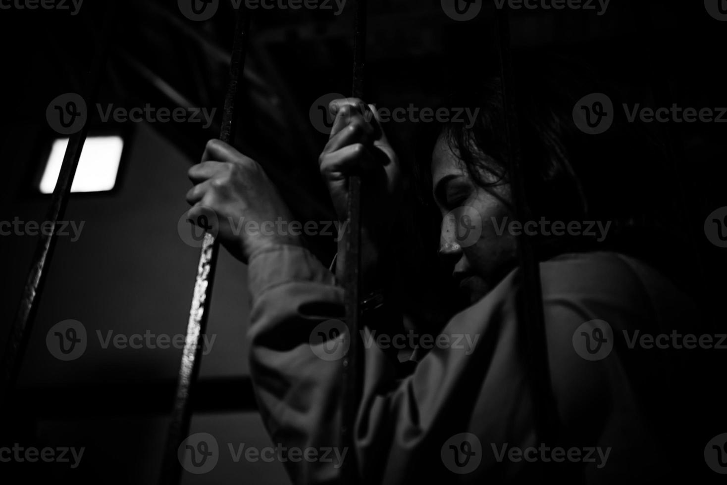 Hands of women desperate to catch the iron prison,prisoner concept,thailand people,Hope to be free,If the violate the law would be arrested and jailed. photo