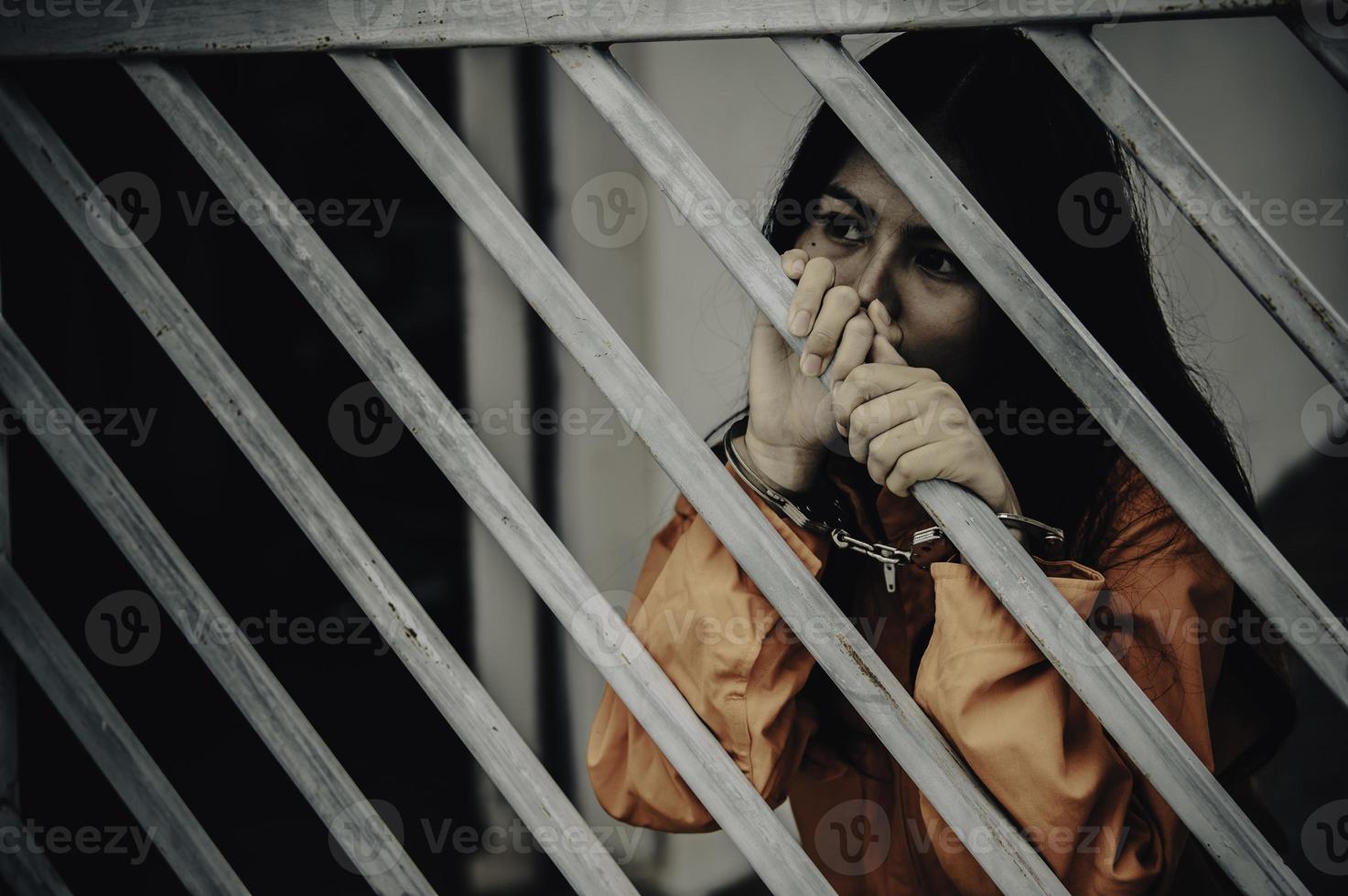 Hands of women desperate to catch the iron prison,prisoner concept,thailand people,Hope to be free,If the violate the law would be arrested and jailed. photo