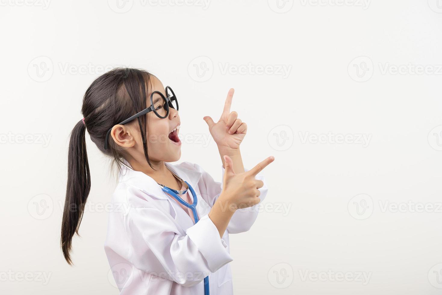 Asia little girl playing doctor isolated on white photo