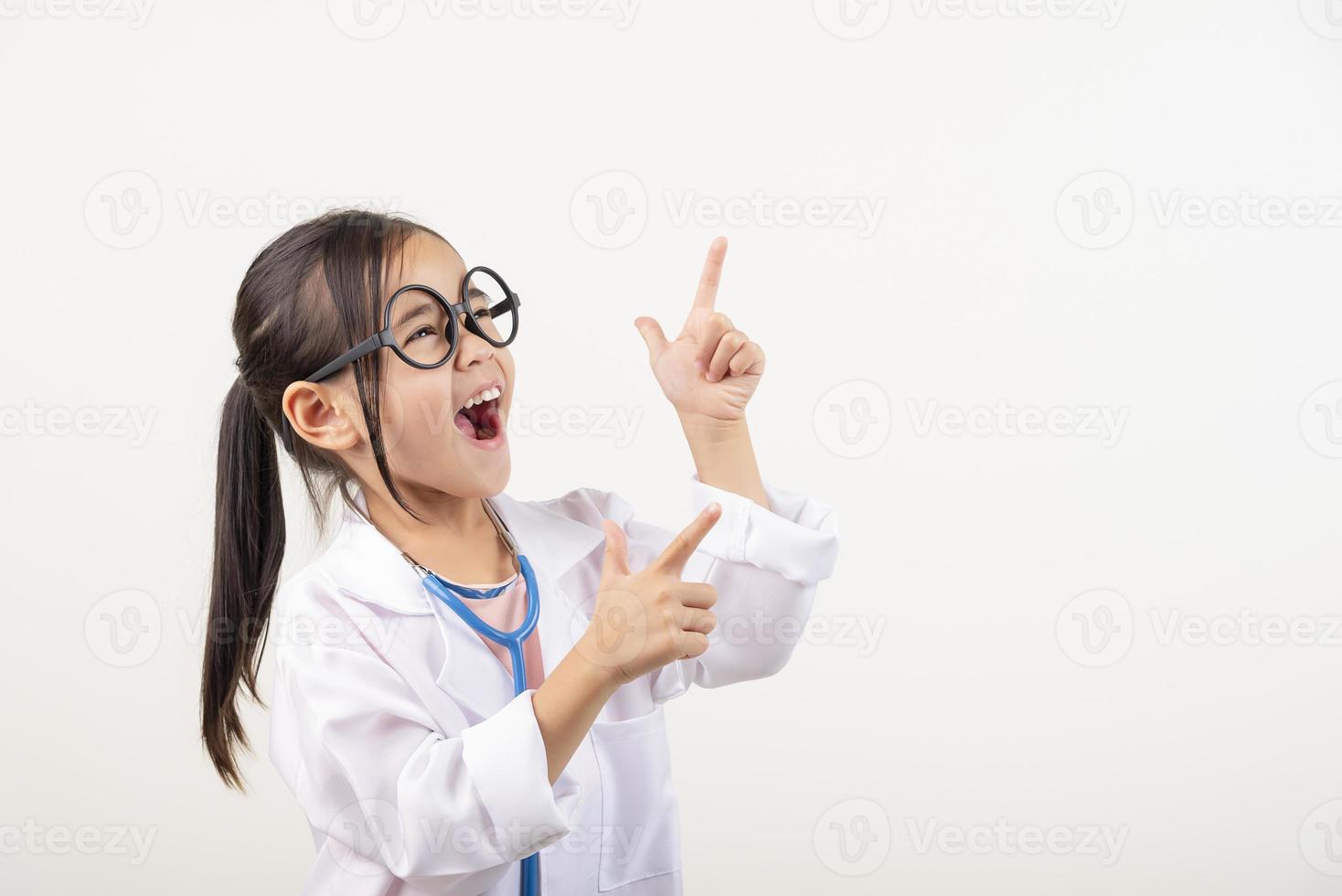 Asia little girl playing doctor isolated on white photo