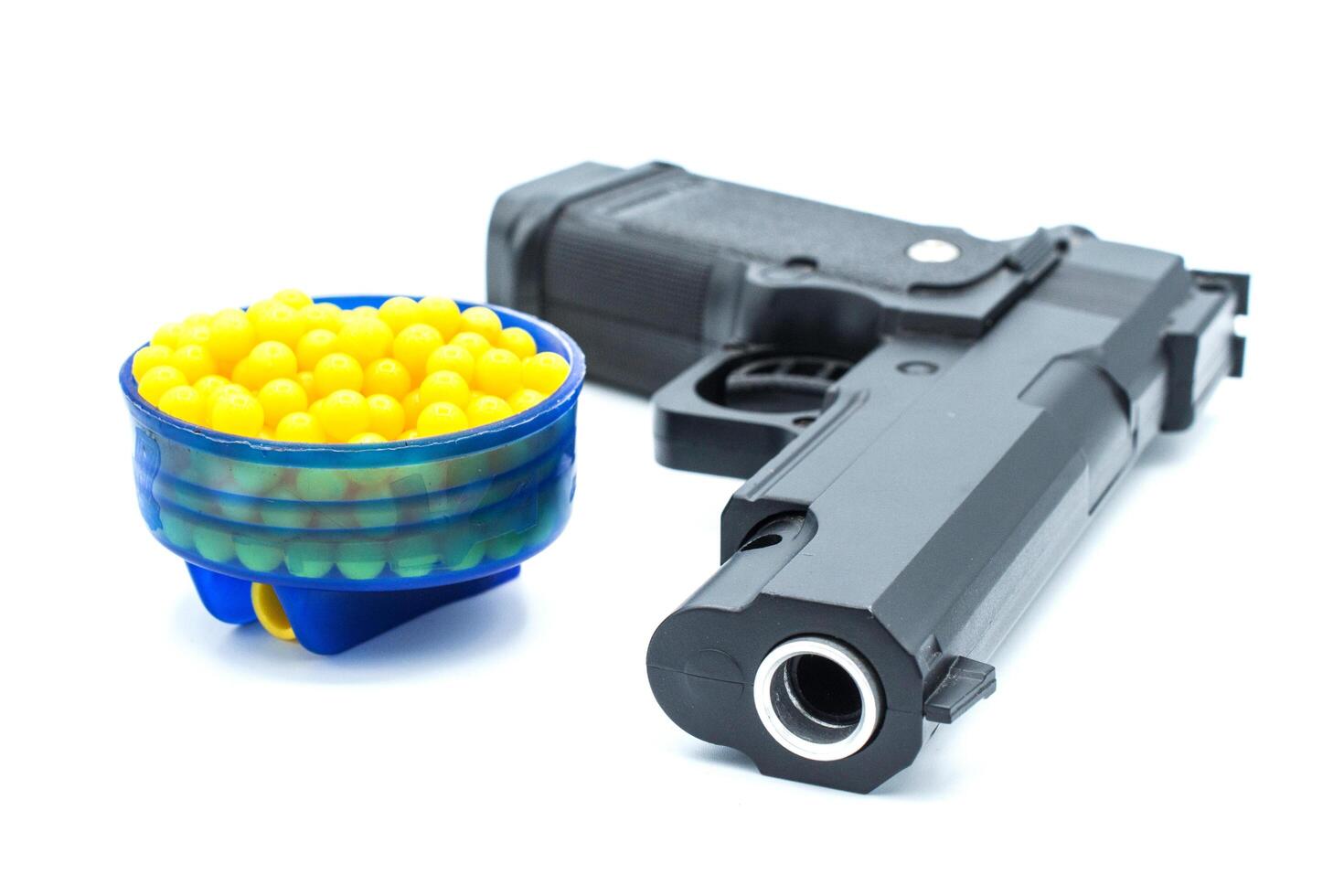 Air gun with plastic bullet on isolated background. Air guns are