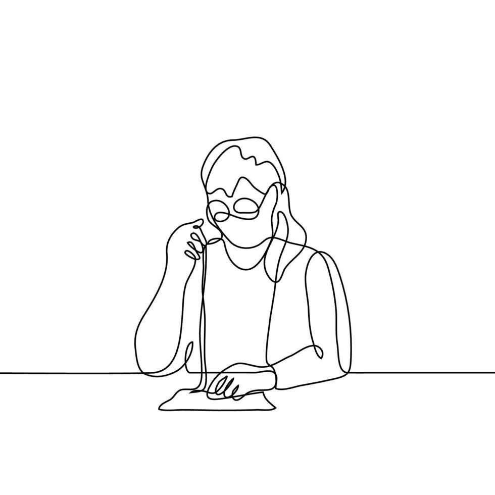 A woman with glasses sits at a table and sews something. One continuous line art full of elderly woman is engaged in her hobby needlework, sewing. Can be used for animation. vector