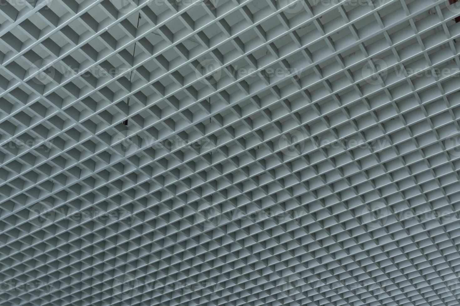 grid ceiling background is beautiful because it is designed to cover traces of original ceiling resulting in modern grid ceiling pattern. backdrop of ceiling is decorated with steel in grid pattern. photo