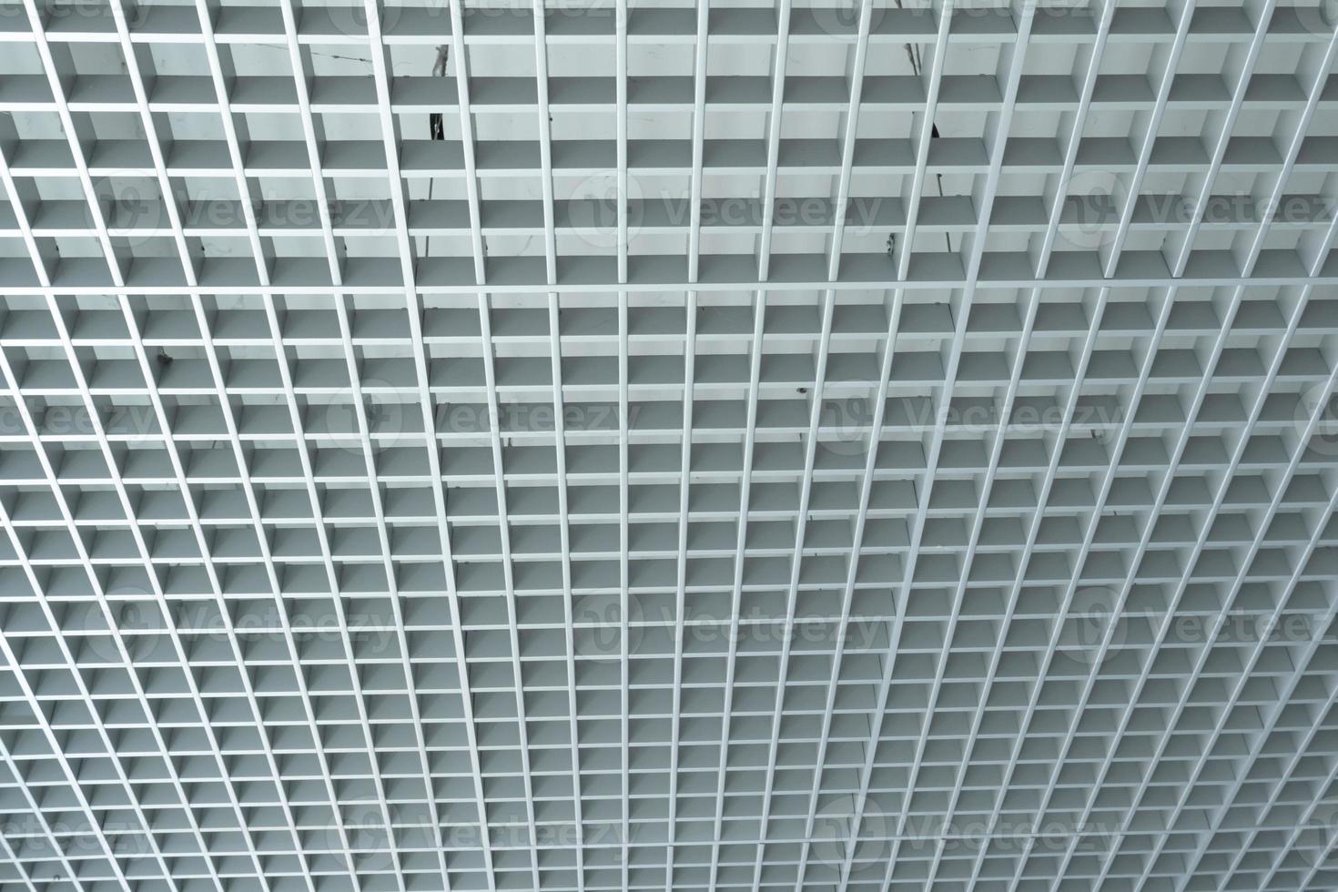 grid ceiling background is beautiful because it is designed to cover traces of original ceiling resulting in modern grid ceiling pattern. backdrop of ceiling is decorated with steel in grid pattern. photo