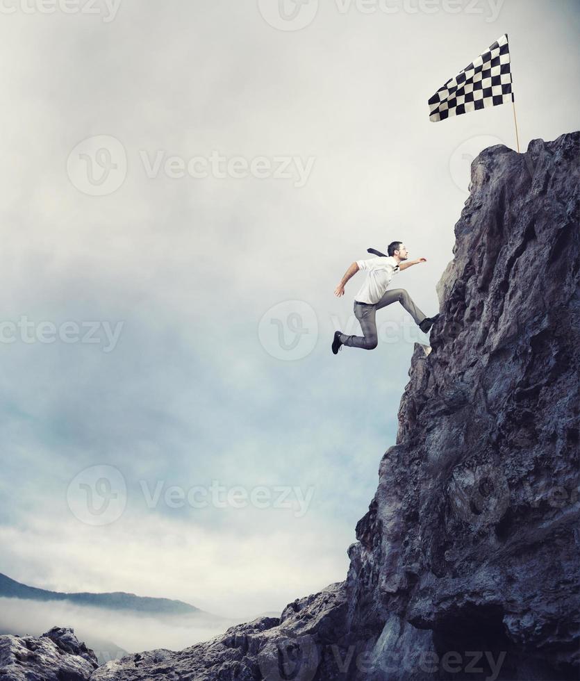 Reach the flag. Achievement business goal and difficult career concept photo