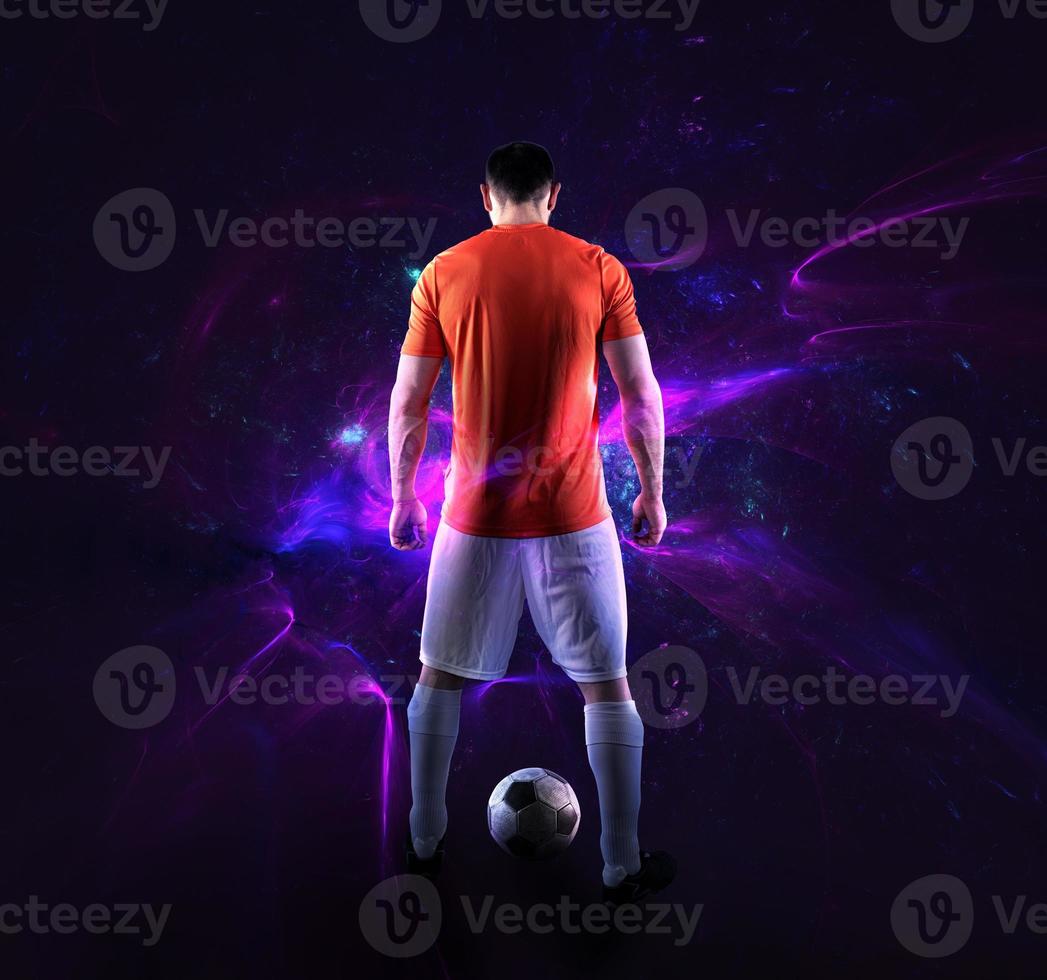 Football scene with soccer player in front of a futuristic digital background photo