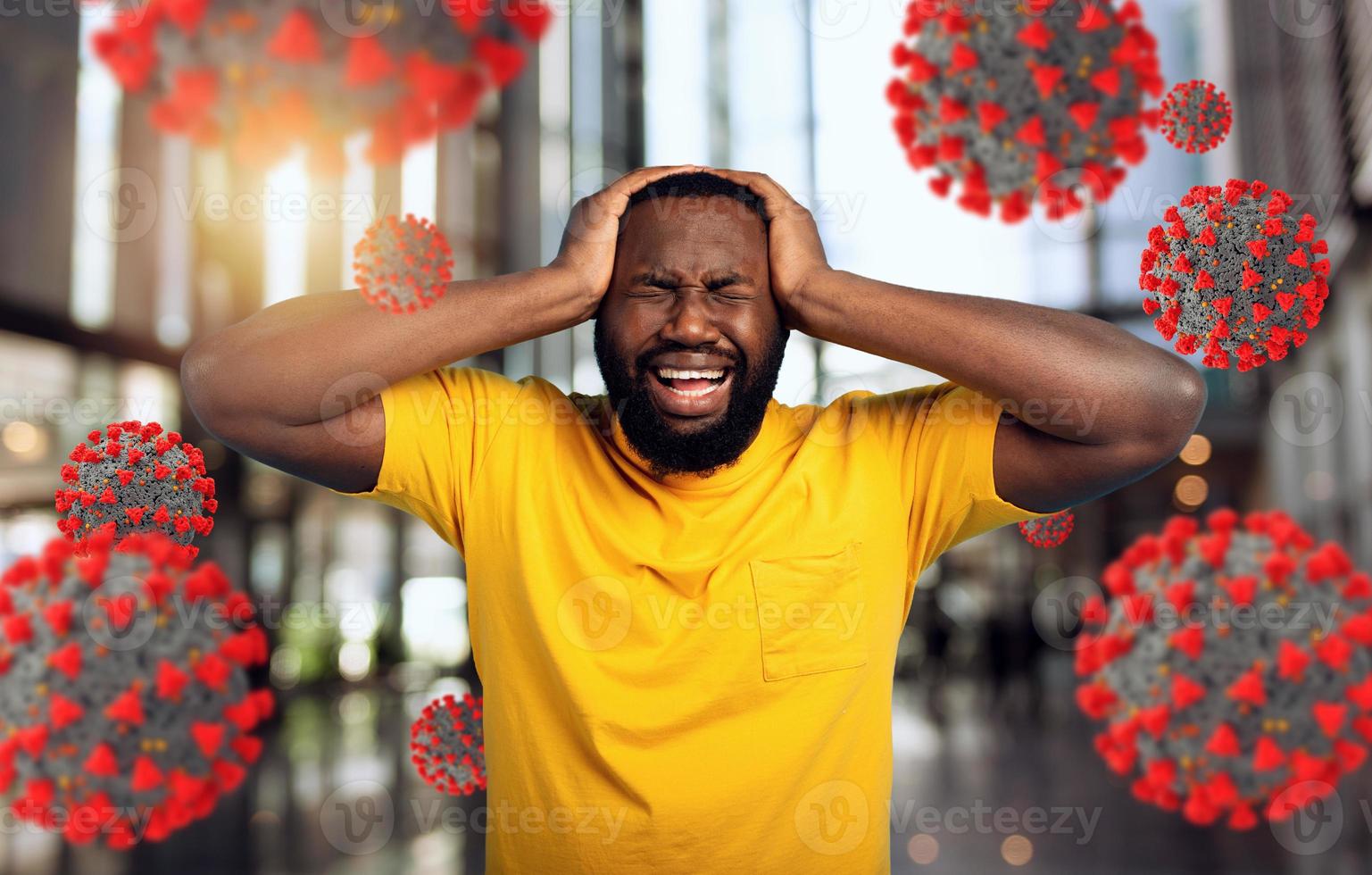 Sad and desperate expression of a boy who is scared to catch the covid-19 coronavirus. Cyan background. photo