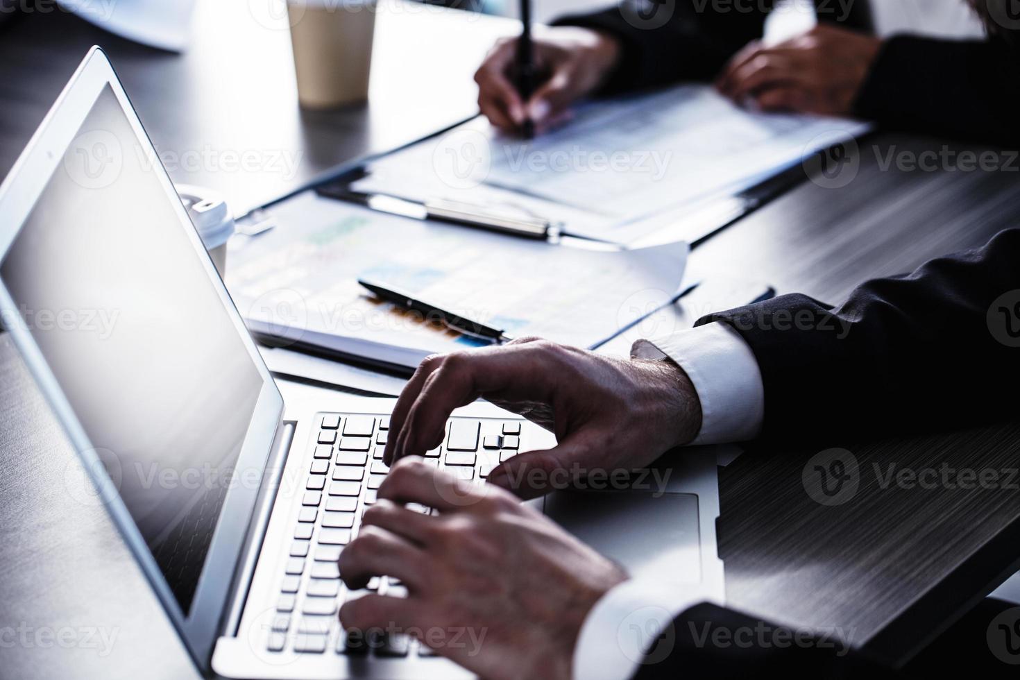 Man working on a laptop. Concept of internet sharing and interconnection photo