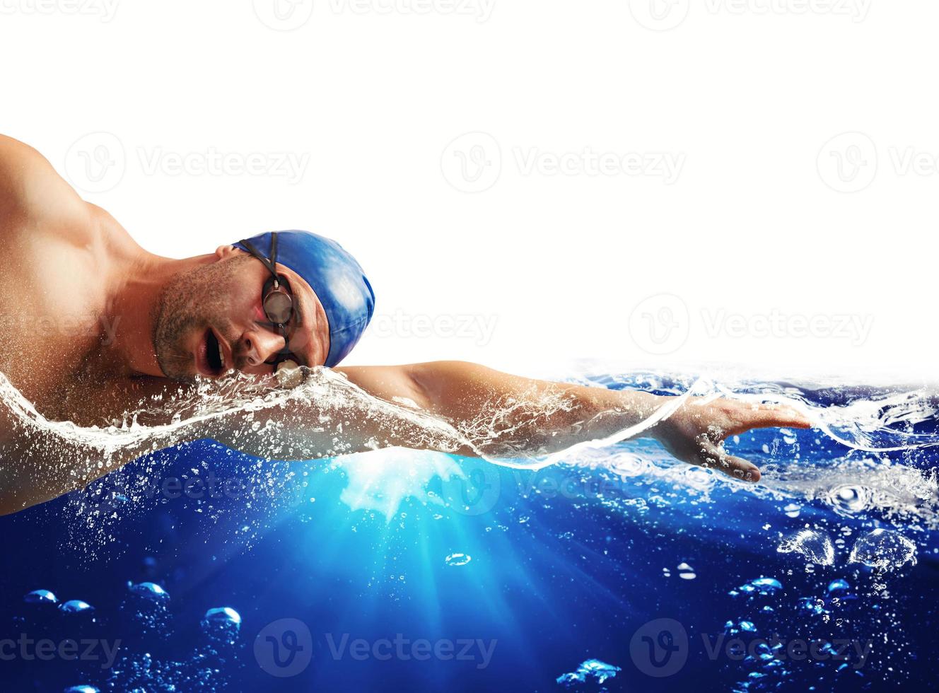 Boy swims in a blue deep water . white space for your text photo