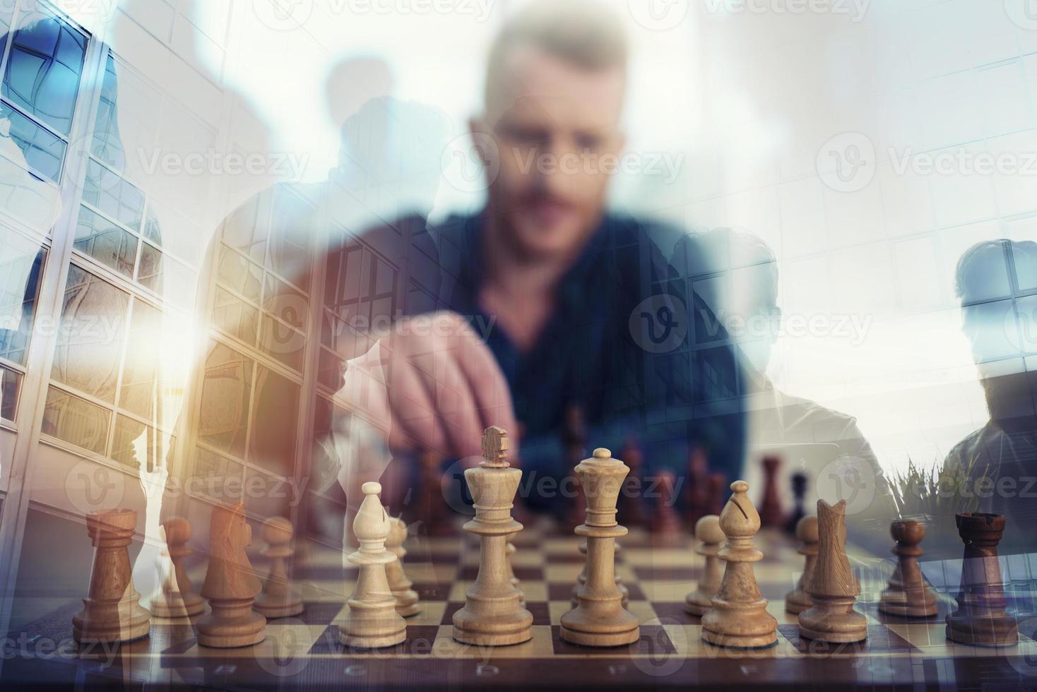 Businessman play with chess game. concept of business strategy and tactic. Double exposure photo