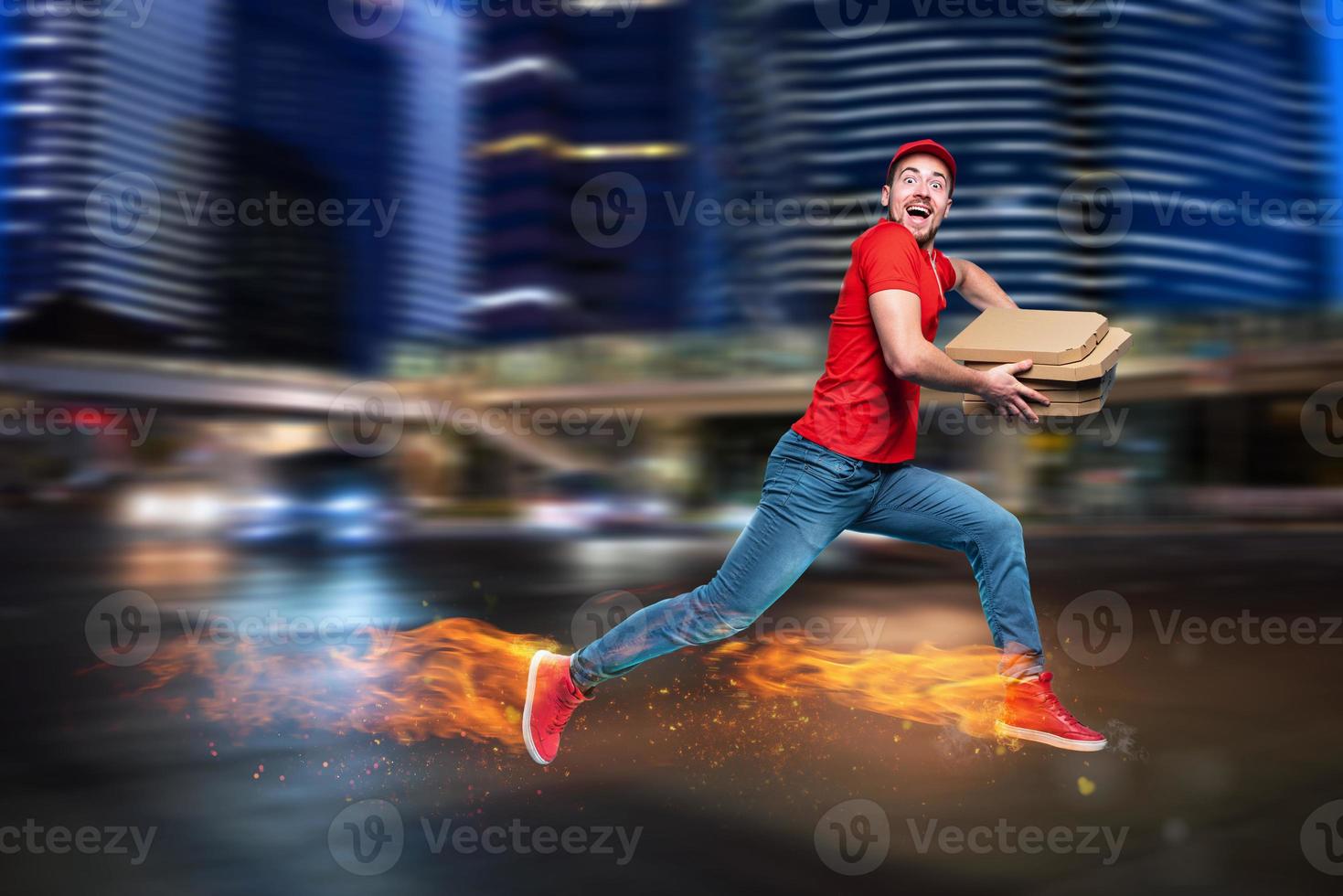 Courier runs fast to deliver quickly pizzas with fiery feet. Cyan background photo