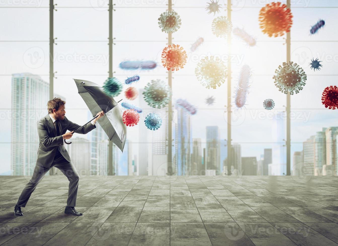 Businessman with umbrella covers himself from bacteria. Concept of solution to stop viruses contamination and pandemic photo