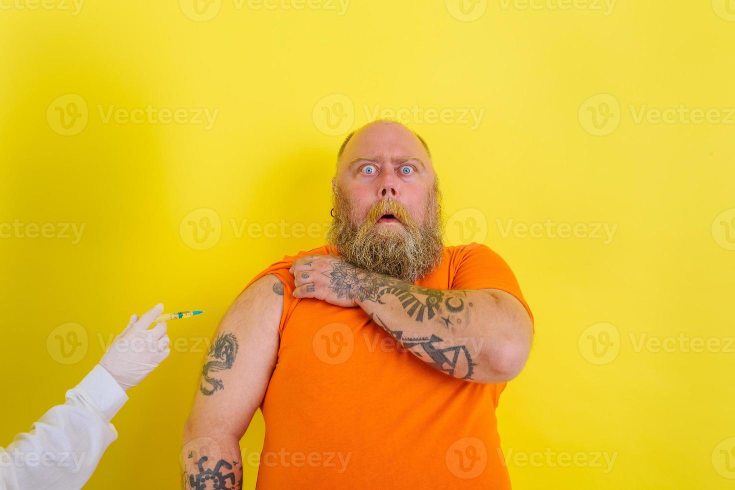 Afraid man is afraid of getting the covid-19 vaccine photo
