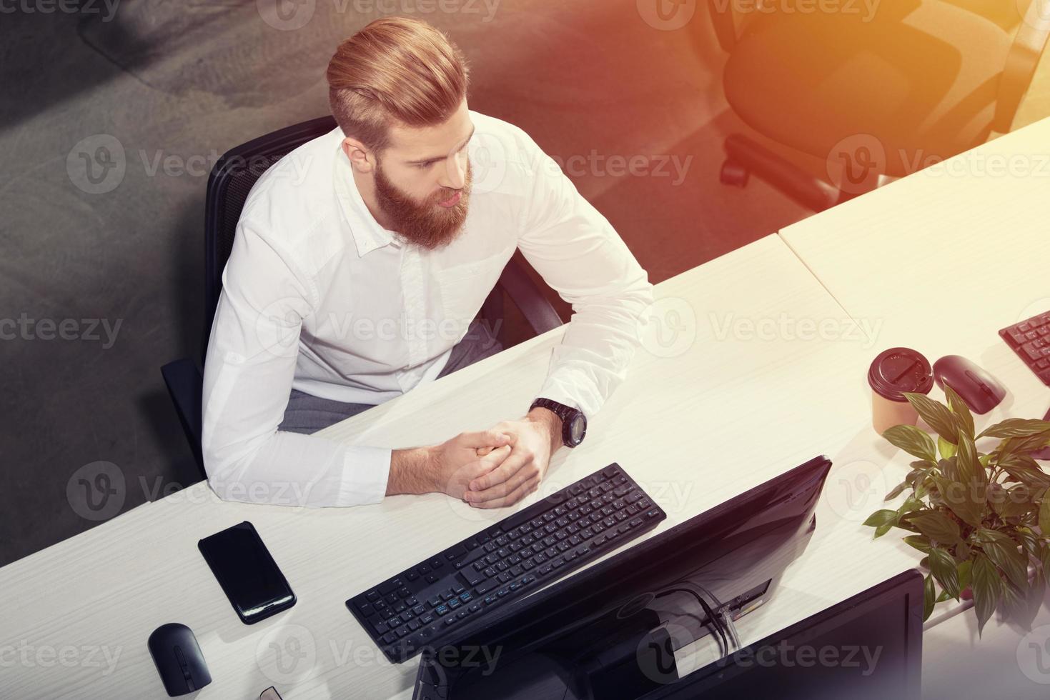 Businessman in office connected on internet network. concept of startup company photo