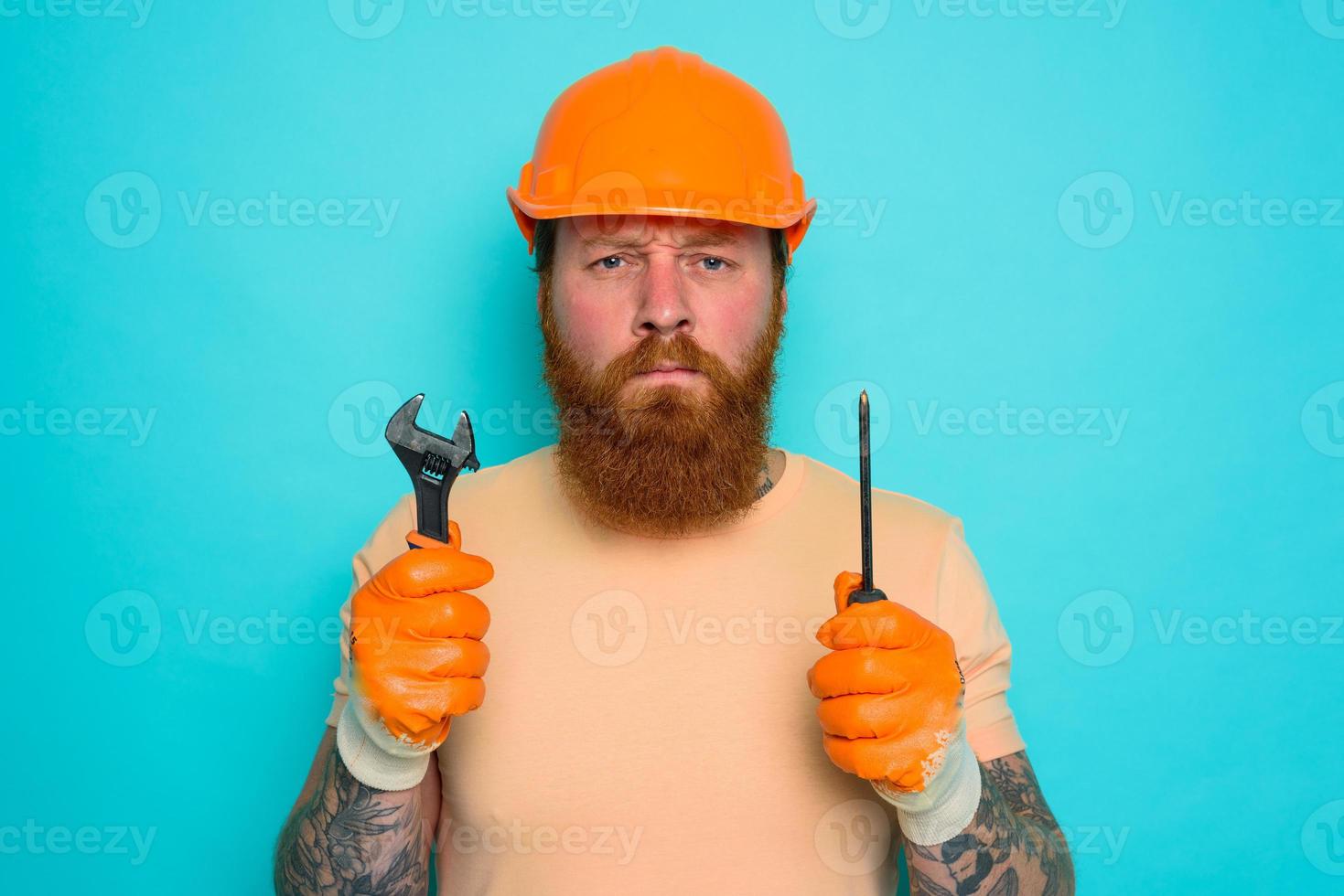 Incompetent worker is afraid and worried about his work photo