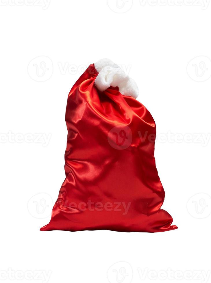 Santa claus sack full of christmas gifts ready to deliver photo