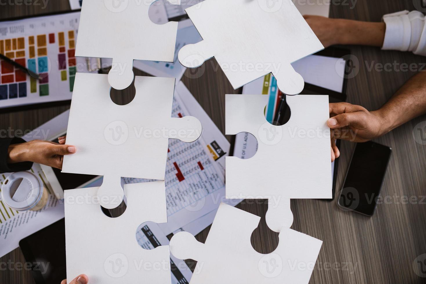 Teamwork of partners. Concept of integration and startup with puzzle pieces photo