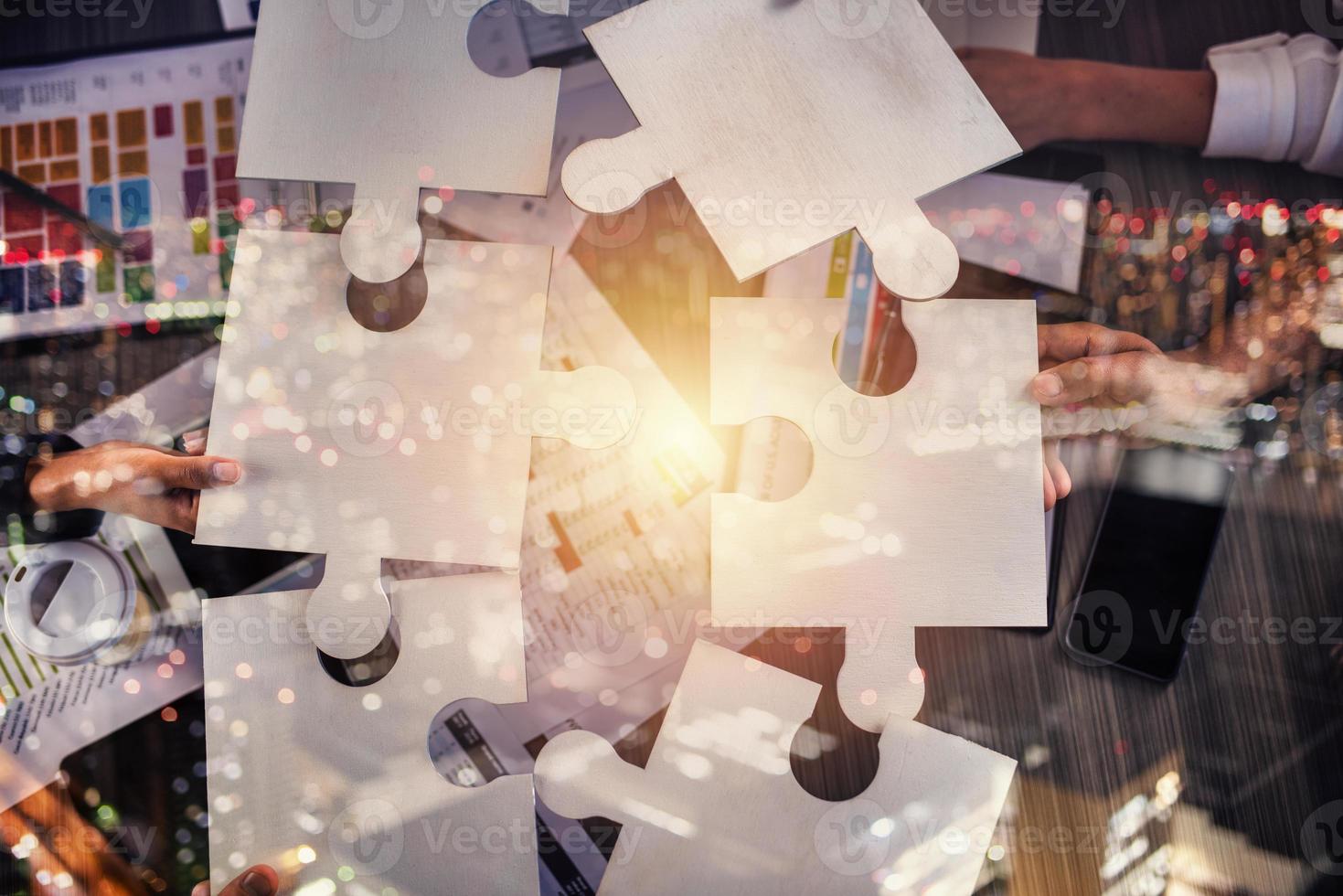 Teamwork of partners. Concept of integration and startup with puzzle pieces photo