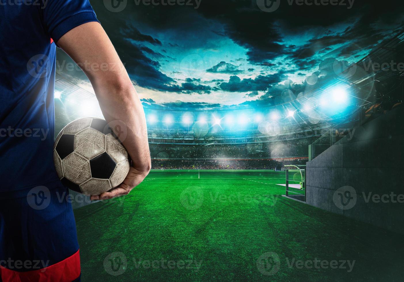 Soccer player ready to play with ball in his hands at the exit of the locker room tunnel photo