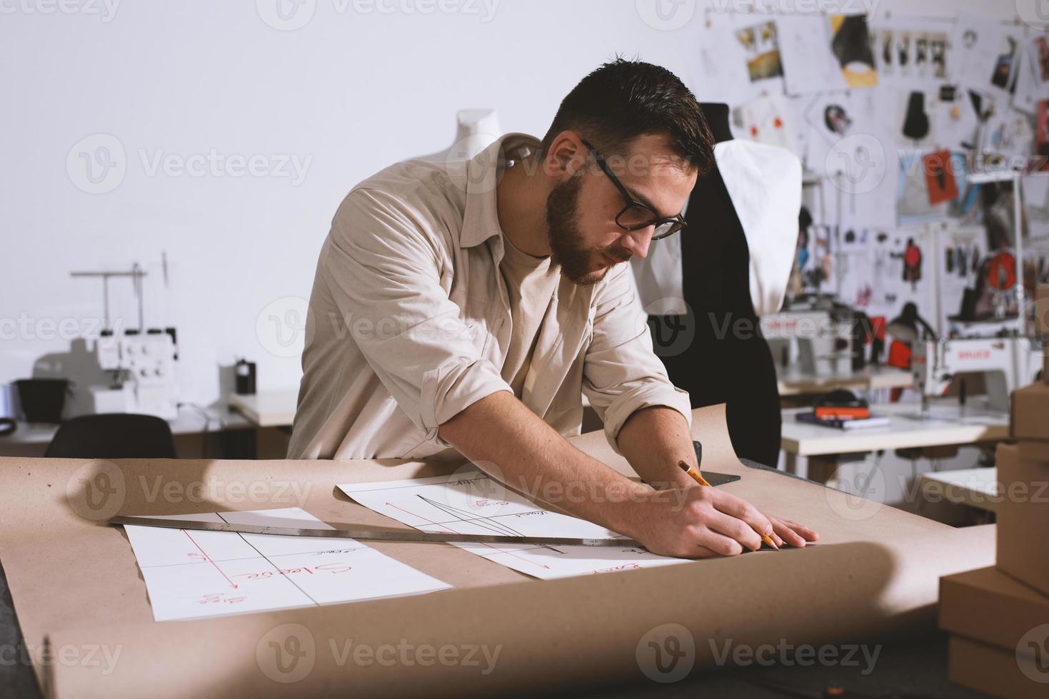 Seamstress works to new clothes ordered by internet client photo