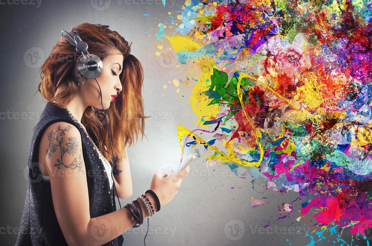Tattoo girl listens to music photo
