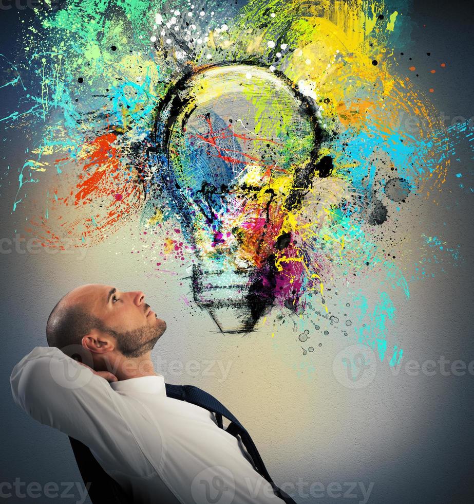 Businessman thinks of a new creative idea photo